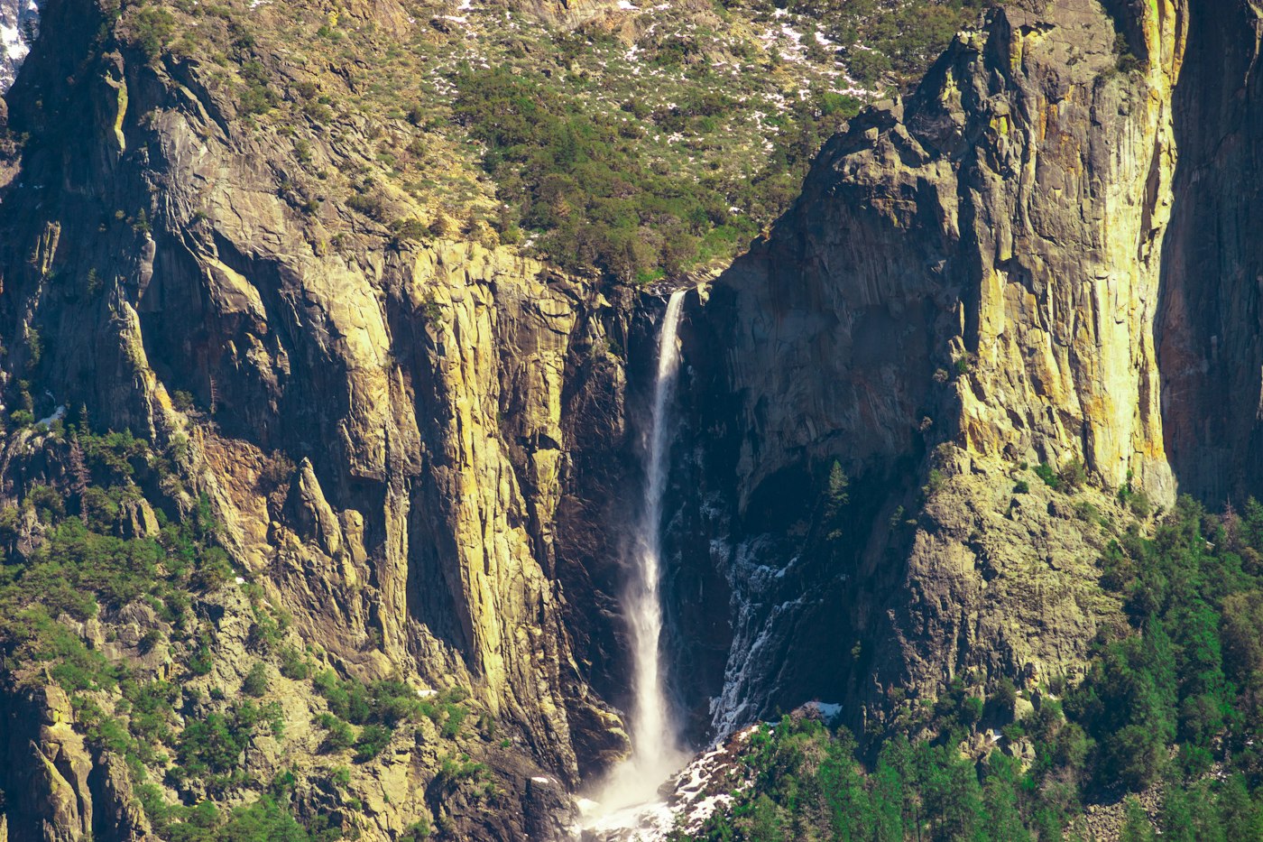 Bridalveil Fall dropping between granite cliffs in Yosemite Valley