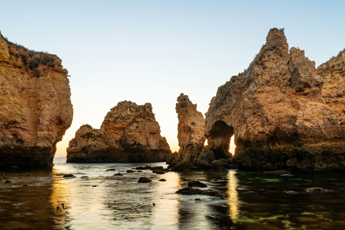 Golden limestone sea stacks at Ponta da Piedade in the Algarve